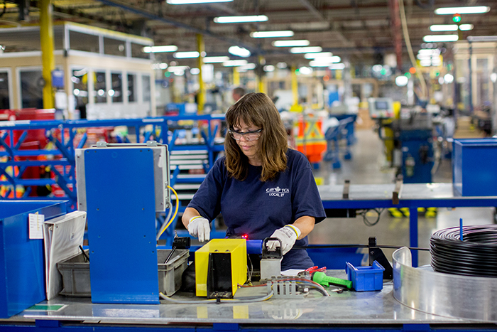 Woman working in production environment